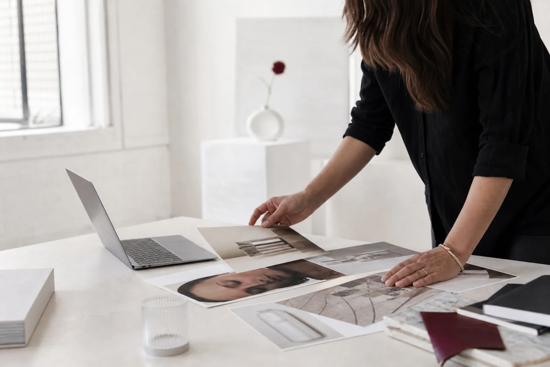 A brand lead art-directing visual references beside a laptop